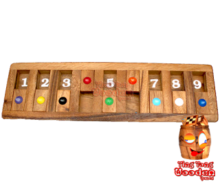 Shut the box or flap game as a game board version for the journey. Funny drinking dice game for the round Monkey Pod Thailand